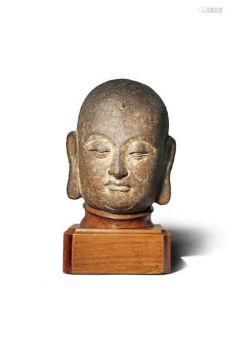 A CHINESE CAST IRON HEAD OF A MONK SONG/YUAN DYNASTY His face with a serene expression and