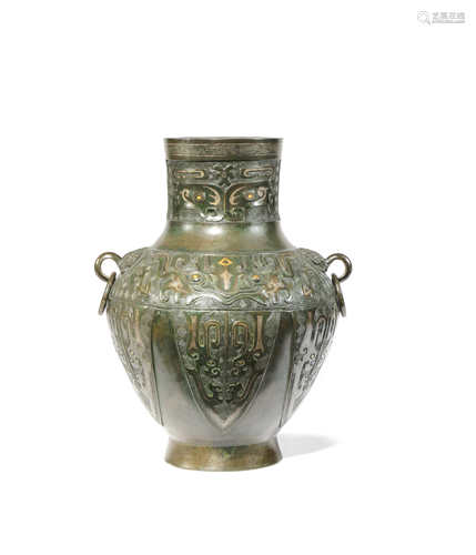 A CHINESE BRONZE HU-SHAPED VASE 18TH CENTURY The ovoid body tapering towards the foot and surmounted