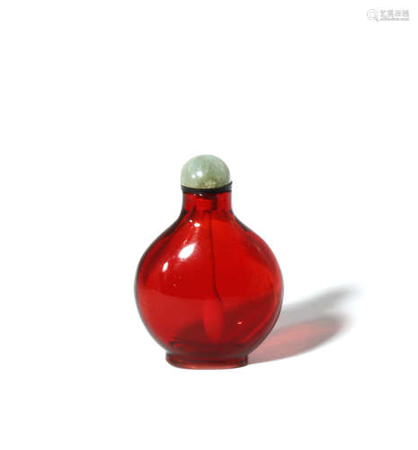 A CHINESE RED GLASS SNUFF BOTTLE QING DYNASTY OR LATER The flattened circular body rising to a short