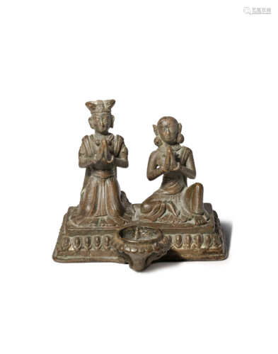 A NEPALESE CAST COPPER SCULPTURE OF A KNEELING COUPLE AT PRAYER 19TH CENTURY A lay man and woman,