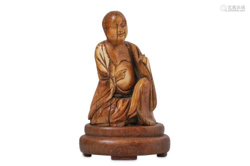 A CHINESE IVORY CARVING OF A LOHAN.