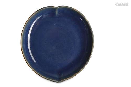 A CHINESE MONOCHROME BLUE 'PEACH' DISH.