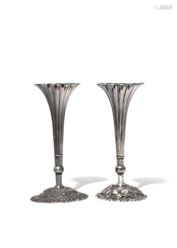 A NEAR PAIR OF JAPANESE SILVER VASES 20TH CENTURY Both with a tall fluted body raised on a large