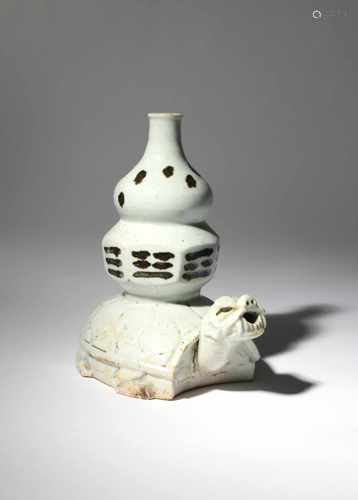 A RARE KOREAN WHITE GLAZE ZOOMORPHIC VASE CHOSON DYNASTY Modelled as a double gourd vase on the back