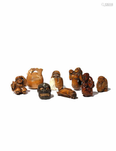 EIGHT JAPANESE WOOD NETSUKE 19TH AND 20TH CENTURY Variously carved as figures, mermaids, a noh mask,