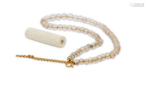 A CHINESE ROCK CRYSTAL NECKLACE AND A JADE BEAD.