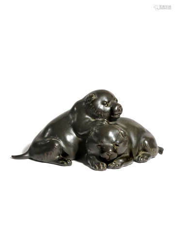 A JAPANESE BRONZE GROUP OF TWO PUPPIES, OKIMONO TAISHO 1912-26 The small dogs depicted resting,