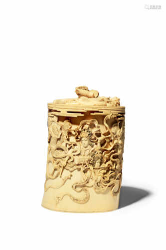 λ A JAPANESE IVORY VASE AND COVER MEIJI 1868-1912 The cylindrical body decorated in high relief with