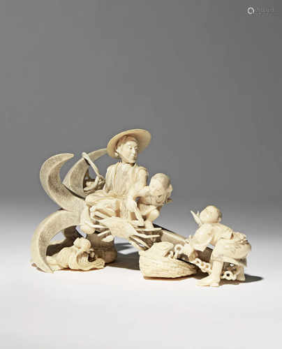 λ A JAPANESE IVORY CARVING, OKIMONO MEIJI 1868-1912 Depicting a fisherman precariously sitting on