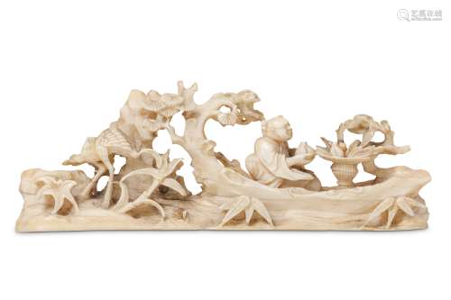 A CHINESE IVORY 'IMMORTAL RAFT' BRUSH REST.