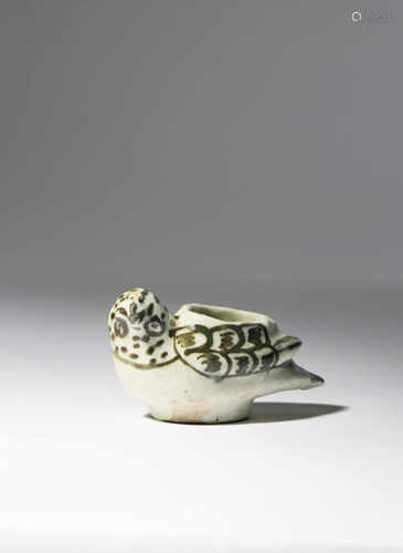 A SMALL POTTERY OIL LAMP 19TH CENTURY Possibly Qajar or Korean and shaped as a small bird, with