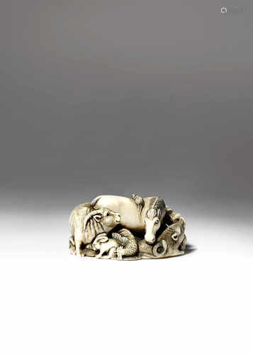 λ A JAPANESE IVORY NETSUKE MEIJI 1868-1912 Depicting the Twelve Zodiac animals compactly interwoven,