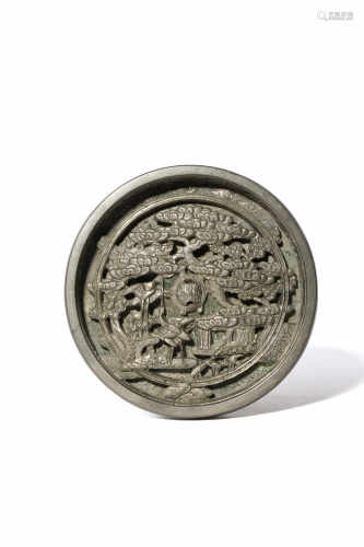 A JAPANESE SILVERED BRONZE MIRROR EDO 1615-1868 The circular body cast in high relief with a central