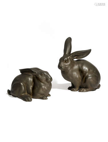 A PAIR OF JAPANESE BRONZE RABBITS, OKIMONO TAISHO 1912-26 The animals depicted resting, one lying on