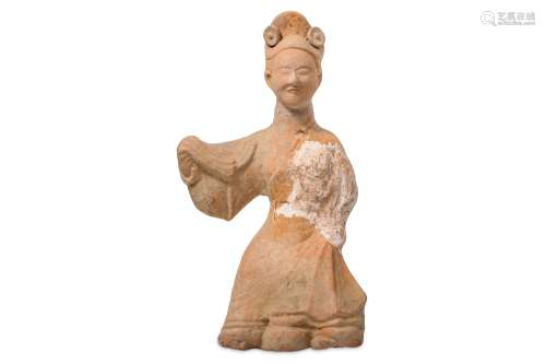 A CHINESE POTTERY FIGURE OF A DANCER.