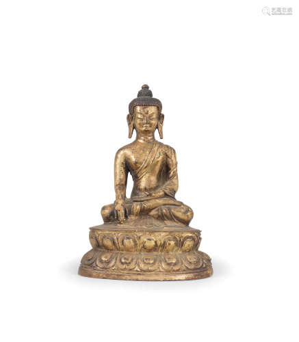 Tibet, 16th/17th century  A gilt-copper alloy figure of Shakyamuni Buddha