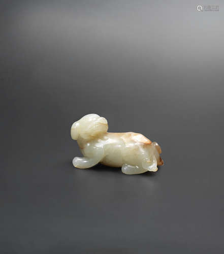 Ming Dynasty A pale green and brown jade mythical animal