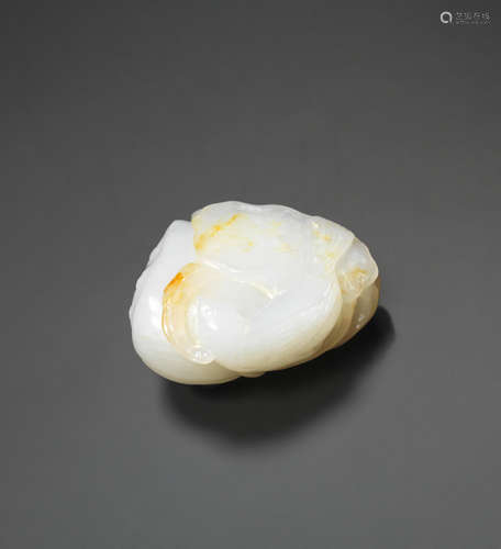 18th century  A white and russet jade 'bird and lotus' carving