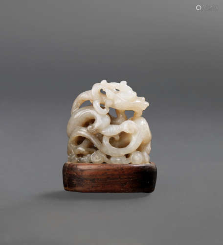 Ming Dynasty A rare white and brown jade reticulated 'dragon' finial