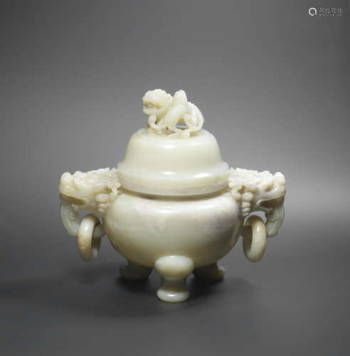 Late Qing Dynasty/Republic period  A large pale green jade tripod incense burner and cover