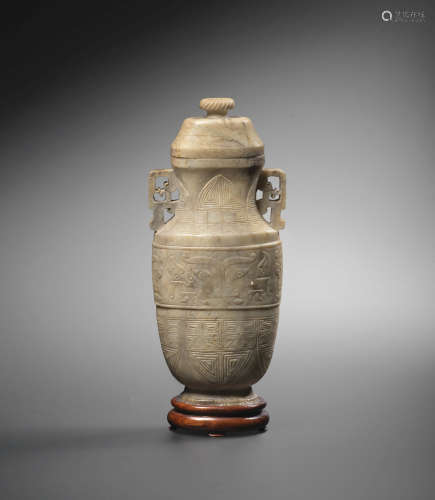 Mid Qing Dynasty A calcified jade archaistic vase and cover