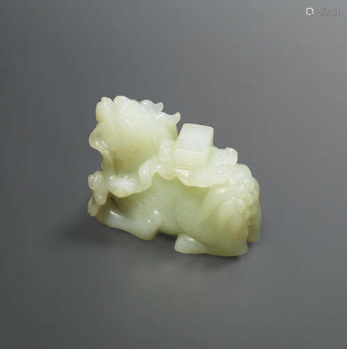 18th century  A very pale green jade carving of a qilin and books