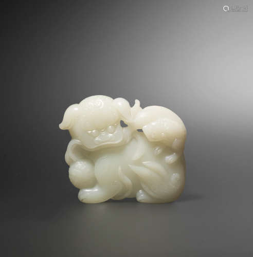 18th century  A white jade 'Buddhist lion and cub' belt buckle