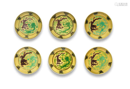 Guangxu six-character marks and of the period A set of six yellow-ground green and aubergine-enamelled 'dragon' saucers,