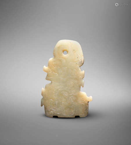 Shang Dynasty A rare pale green jade plaque of a kneeling figure