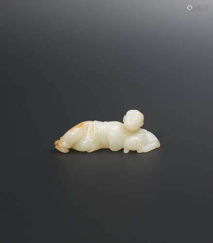 Yuan/Ming Dynasty A very rare white and russet jade 'boy and cat' brush rest