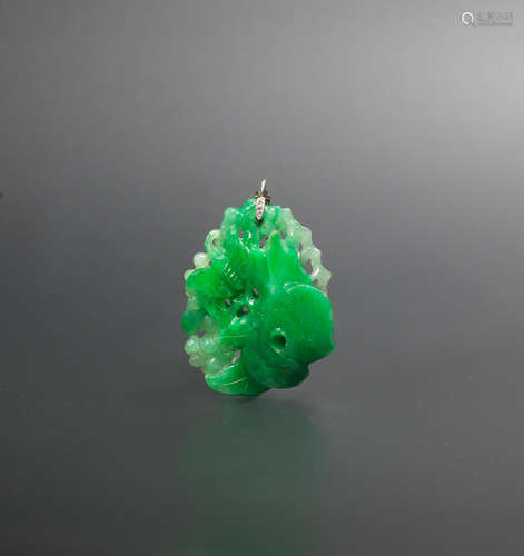 Late Qing Dynasty A jadeite 'birds and grapes' pendant