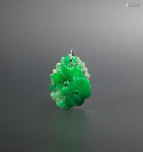 Late Qing Dynasty A jadeite 'birds and grapes' pendant