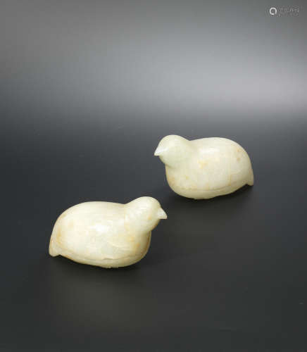 18th/19th century  A pair of pale green and russet jade 'quail' boxes and covers