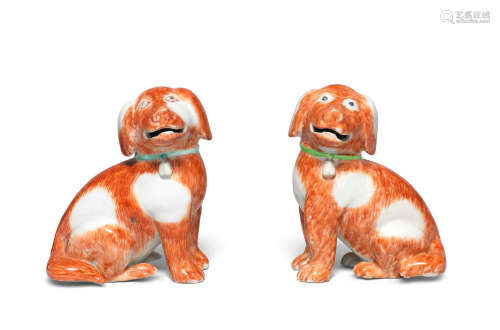 Qianlong, circa 1750 A pair of iron-red enamelled seated spaniels