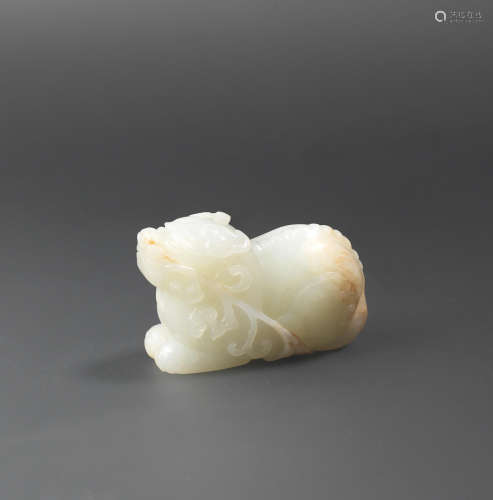 17th/18th century A pale green and russet jade carving of a mythical beast
