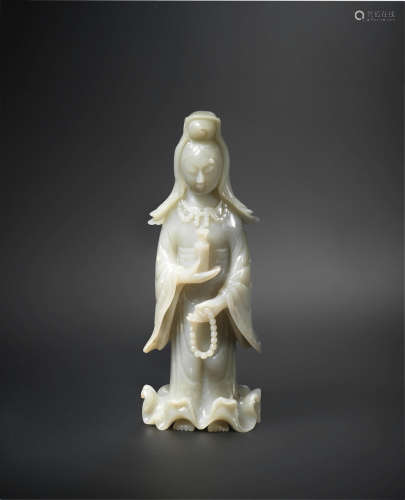 17th/18th century A pale green jade figure of Guanyin