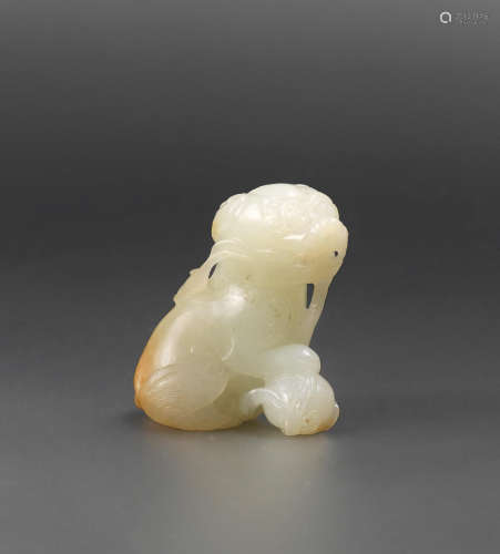 Ming Dynasty A white and russet jade 'Buddhist lion' carving
