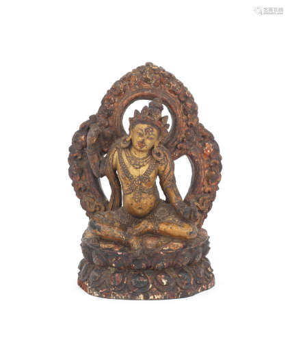 17th/18th century  A carved parcel-gilt lacquered wood figure of a mahasiddha