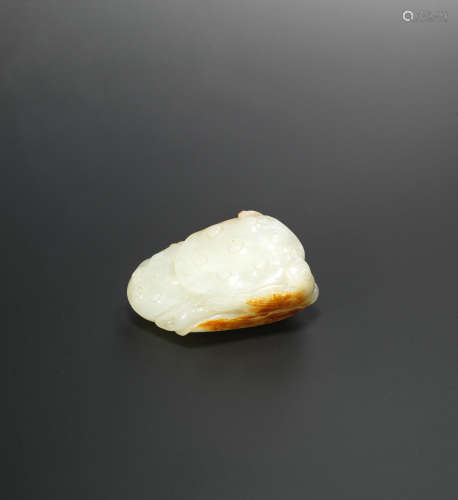 18th century A fine white and russet jade 'lotus pond and bird' carving