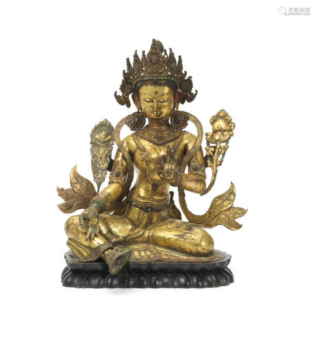 Tibet, 16th century A large gilt-copper repoussé figure of Green Tara