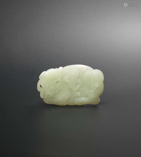 18th/19th century A carved pale green jade 'qilin' double-sided plaque