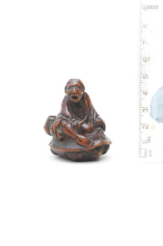 By Gotei, early 19th century A boxwood netsuke of Urashima Taro