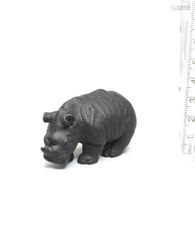 By Michael Webb (1934-2011), Yorkshire, England, circa 1980 A dark-stained boxwood netsuke of a rhinoceros