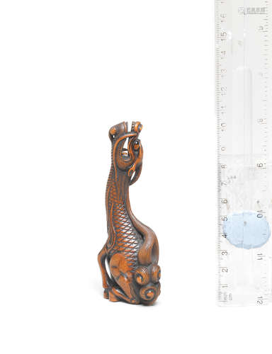 Kyoto, late 18th century A boxwood netsuke of a kirin