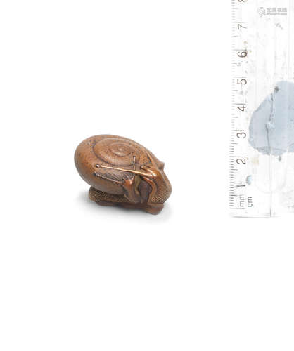 By Yoshiharu, Sado Province, 19th century A boxwood netsuke of a snail and young