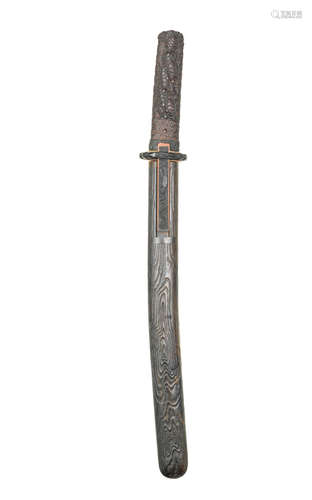 By Kakusen, Iwami Province, early 19th century A kurogaki (black persimmon) wood koshira-e (mounting) for a wakizashi (short sword)