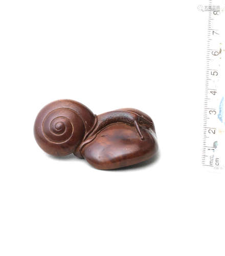 By Soho, 19th century A boxwood netsuke of a snail on a shiitake mushroom