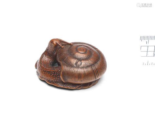 By Baiseki, Iwami Province, late 18th/early 19th century A boxwood netsuke of a snail