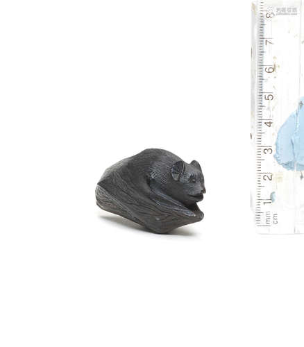 By Ga'no (born circa 1789), first half of the 19th century A kurogaki (black persimmon) wood netsuke of a bat