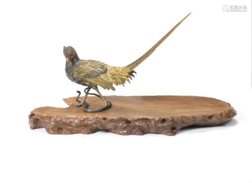 By Genryusai Seiya, Meiji era (1868-1912), late 19th/early 20th century A gilt-bronze okimono of a pheasant and snake